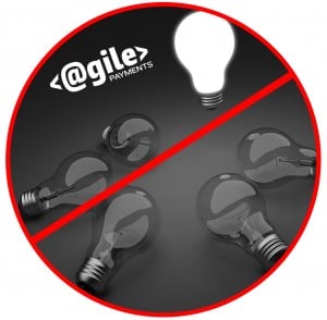 Five clear light bulbs in a circle, one illuminated standing out from the group